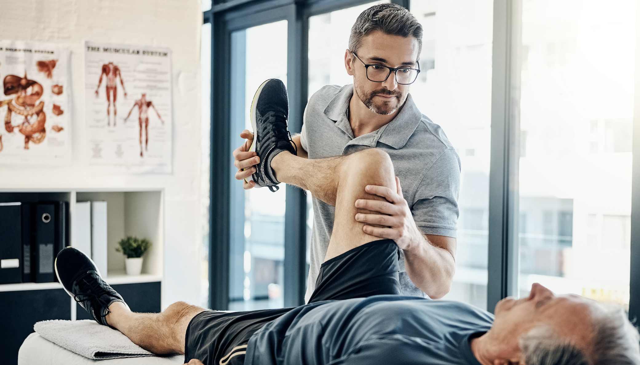 Physical therapist working with patient in a clinical environment/facility