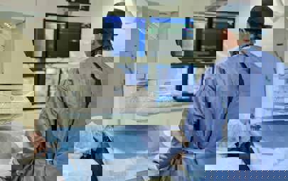 Cath lab tech working in a medical environment Cath lab tech working in a medical environment