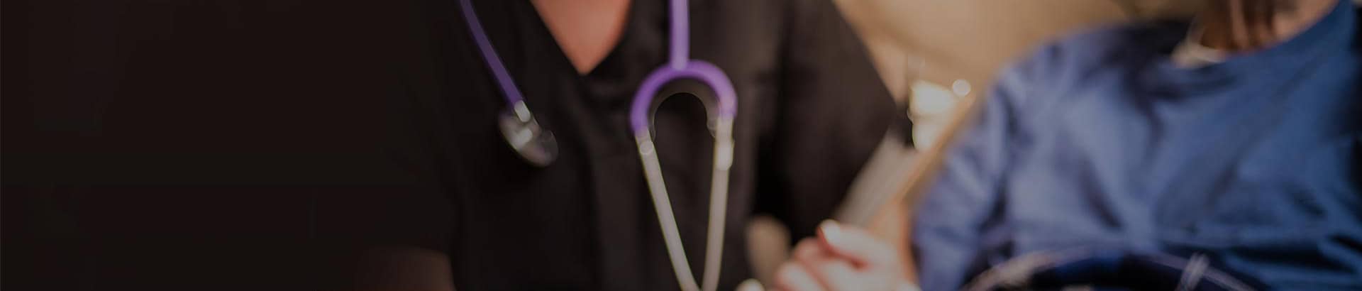 Psychiatric nurse with a stethoscope around her neck.