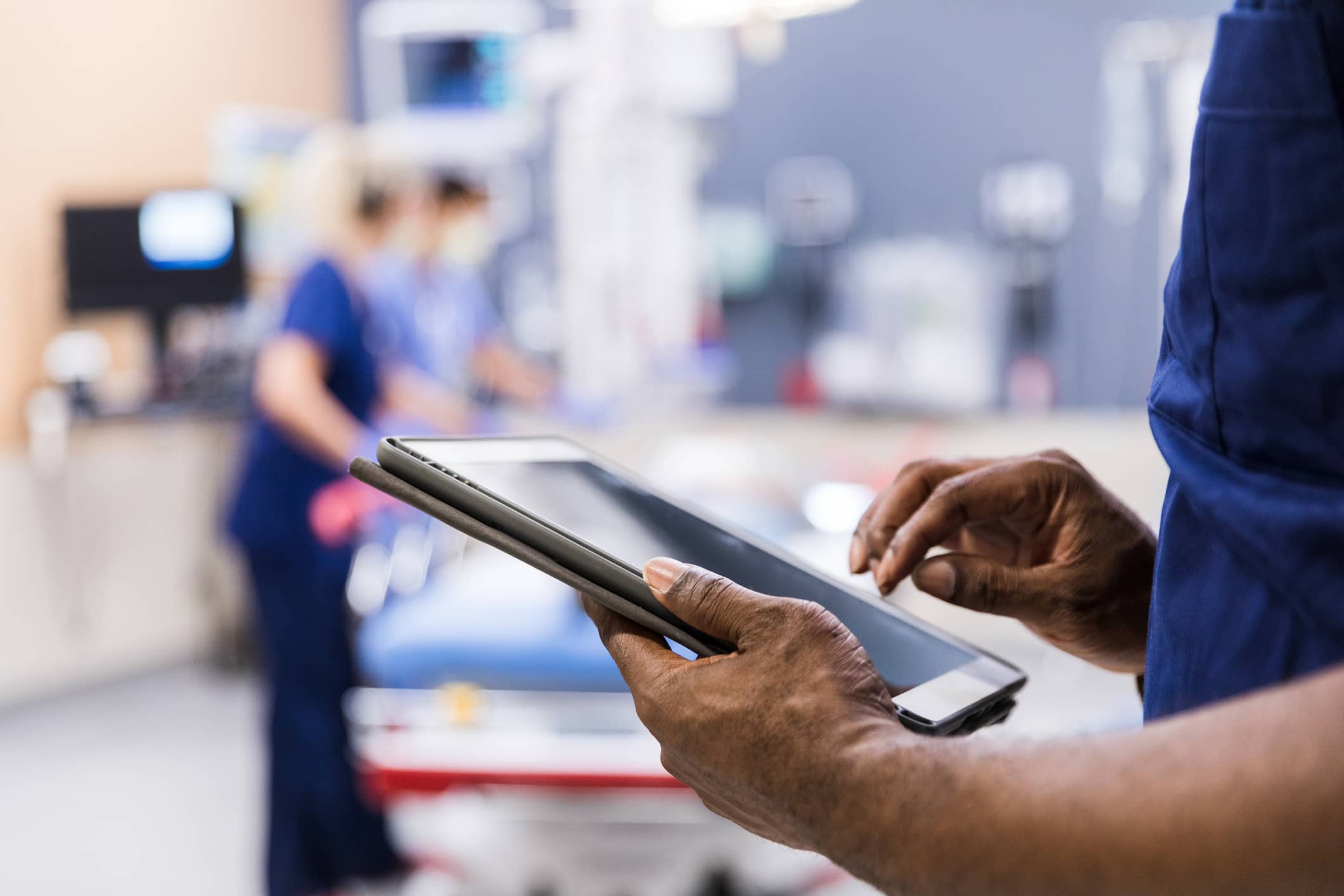 male nurse holding ipad