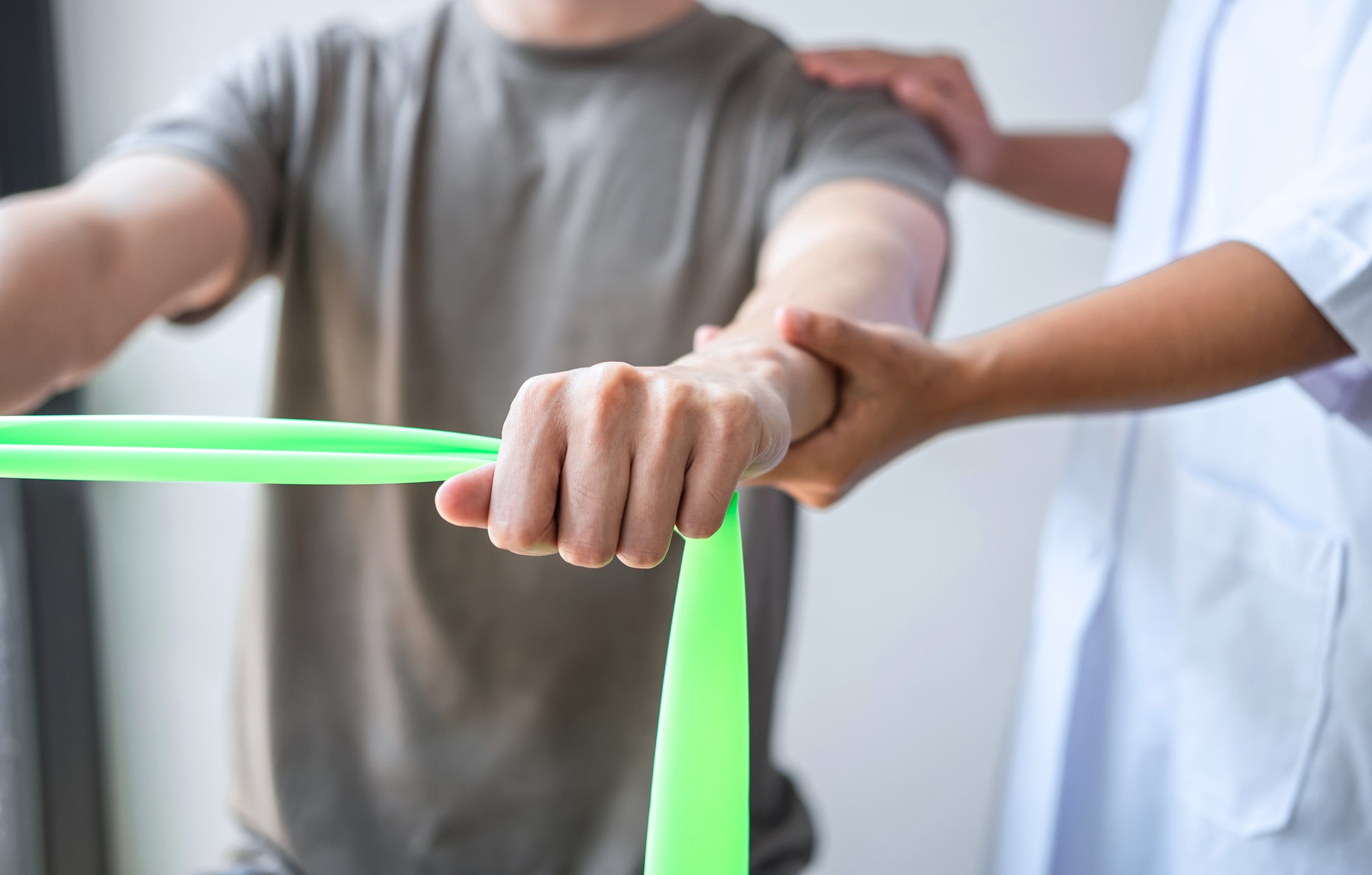 Physical therapist working with patient