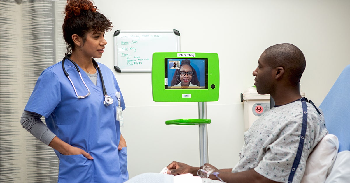 Clinician with a patient awaiting interpreting services