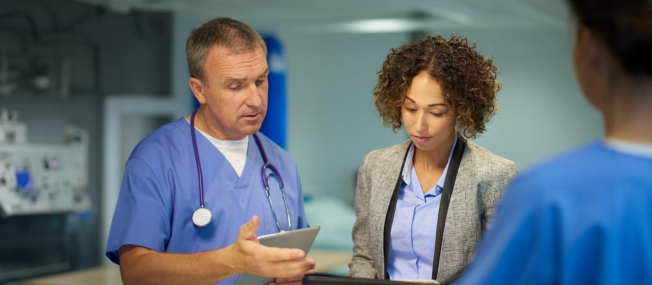 doctor and businesswoman speaking