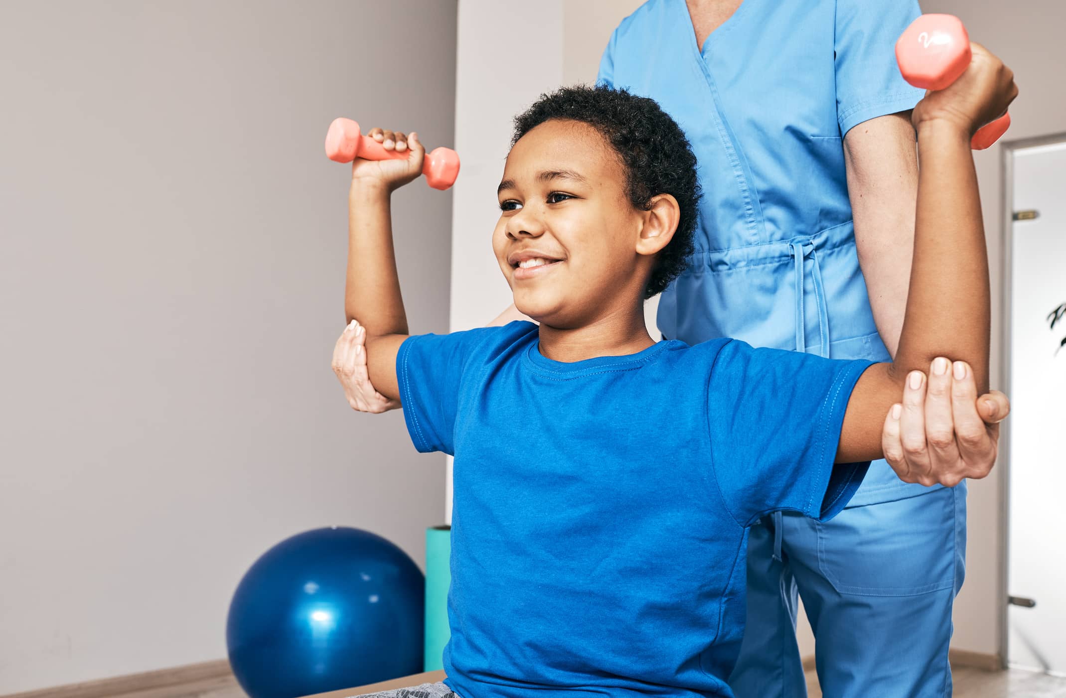 Physical therapist working with child