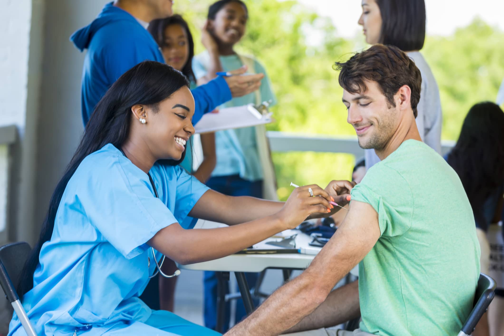 Nurse giving patient injection