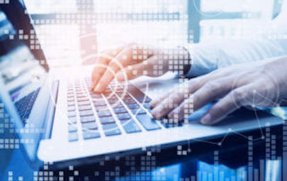 Man's hands on a laptop keyboard with computer dots overlaid on image to evoke technology Man's hands on a laptop keyboard with computer dots overlaid on image to evoke technology