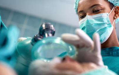 a CRNA working in an operating environment a CRNA working in an operating environment
