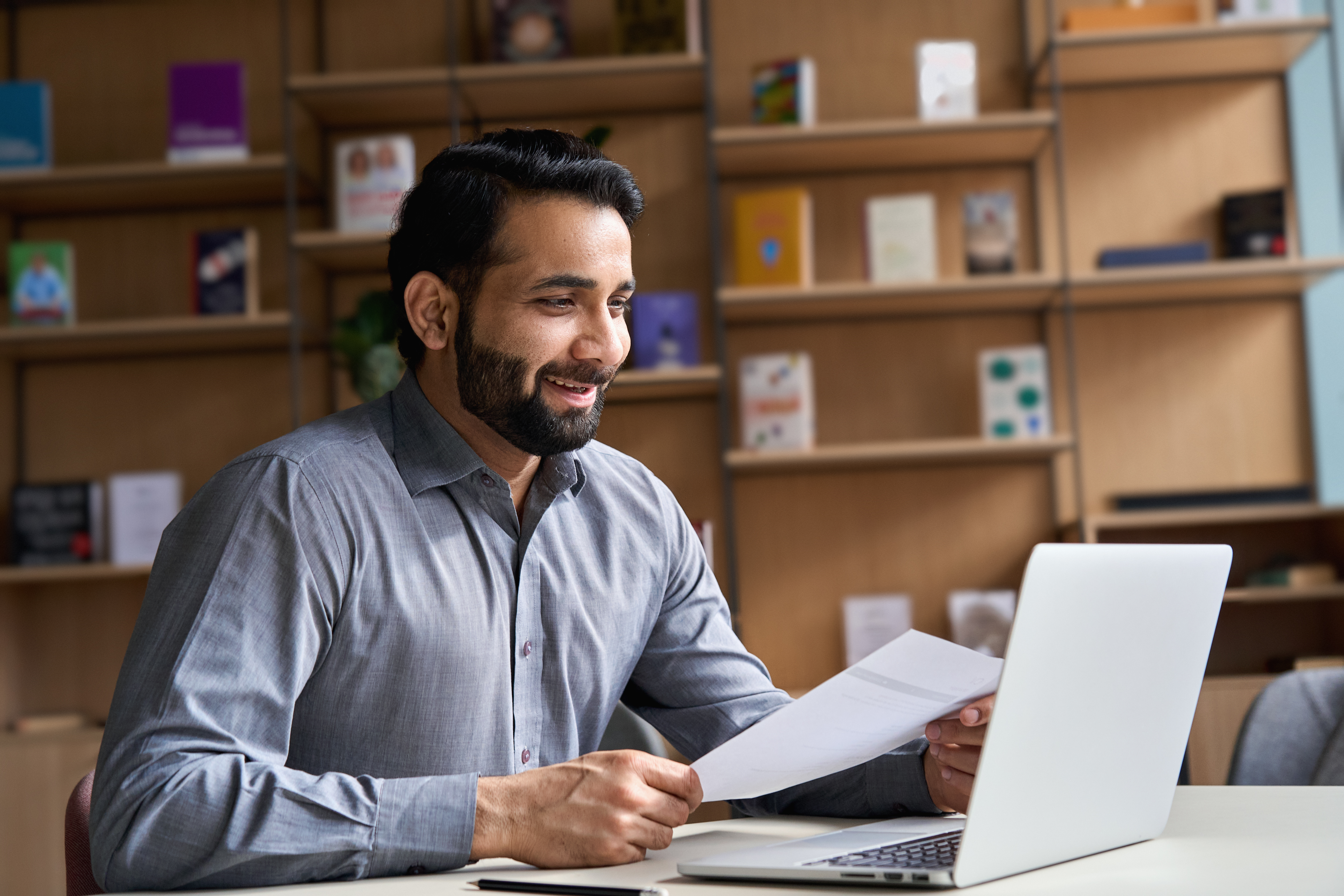 Man sitting in front of a computer studying Man sitting in front of a computer studying