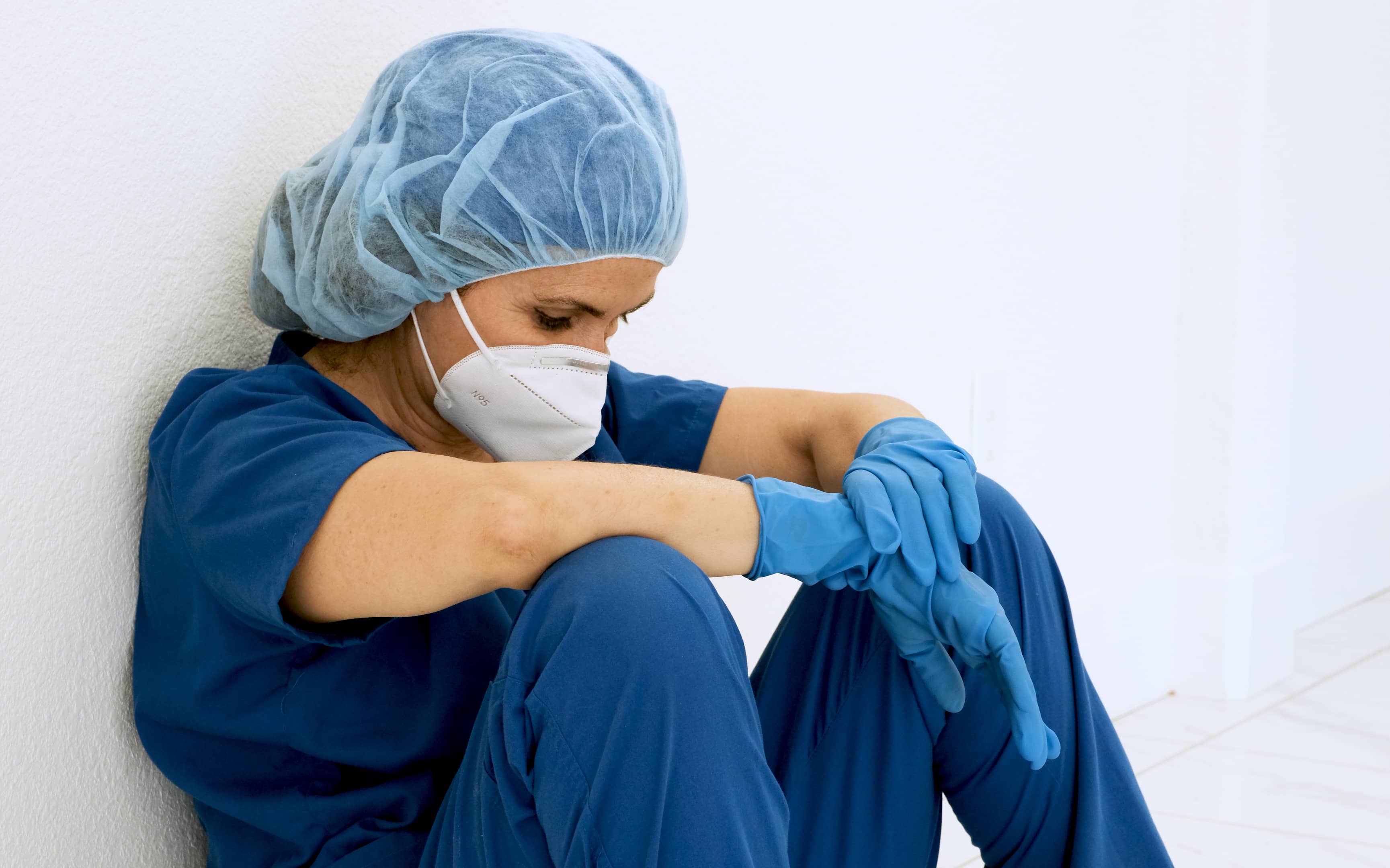Nurse exhausted from the work day Nurse exhausted from the work day