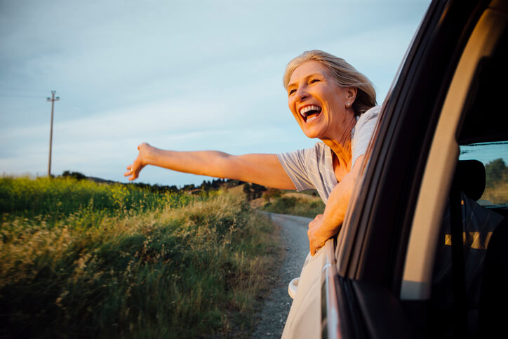 Travel nurse hanging out window in route to assignment