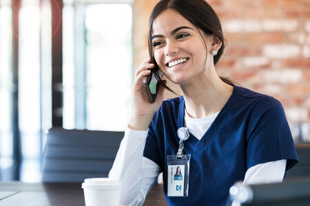 Travel nurse on the phone with a patient