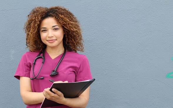 Travel nurse with a clipboard in her hand