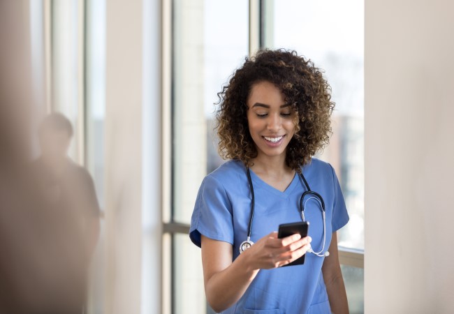 Travel Nurse Checking Her Pay on Her Phone