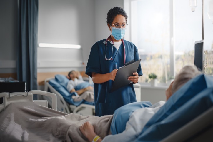 nurse looking at a patient