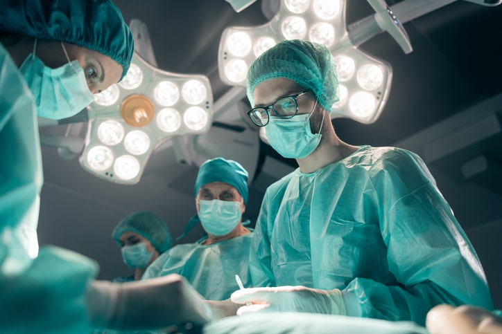 Surgeons working on a patient in the OR Surgeons working on a patient in the OR