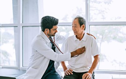 Physician listening to patients heart Physician listening to patients heart