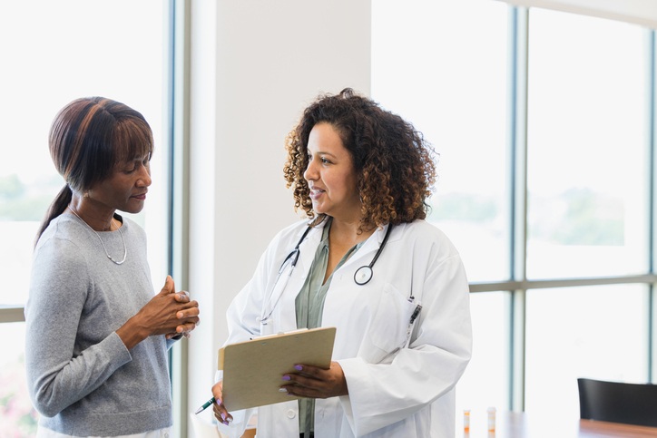 a physician talking to a patient a physician talking to a patient