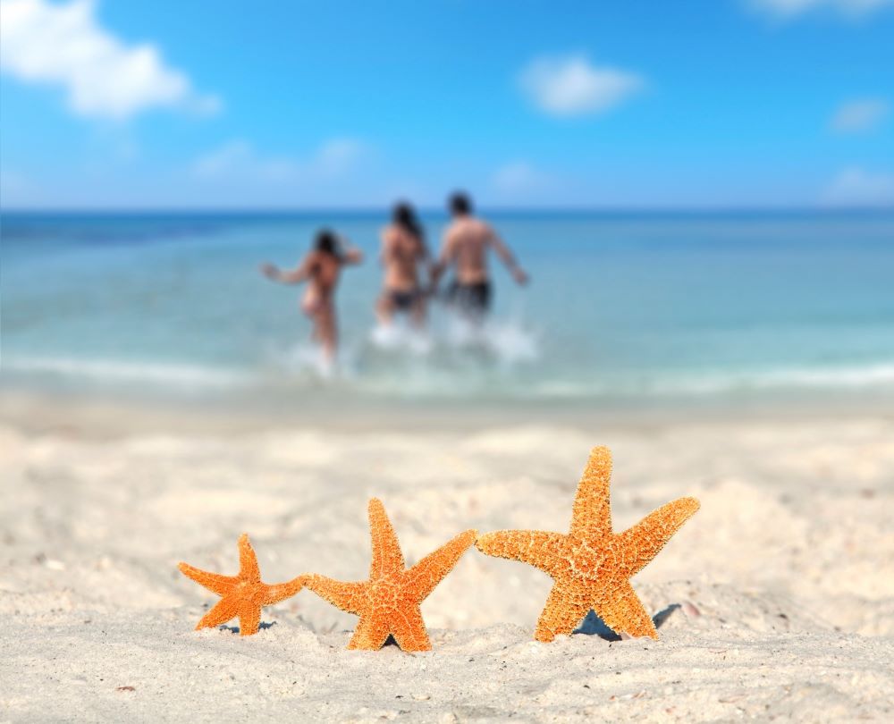 family of 3 in ocean in florida