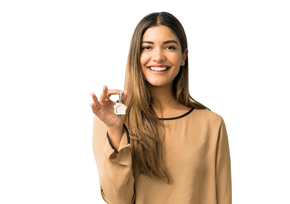 a travel nurse smiling and holding her house keys in front of her