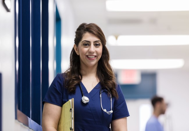 Happy nurse practitioner in hospital setting