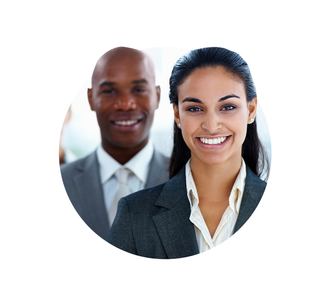 Woman executive smiling with male smiling behind her.