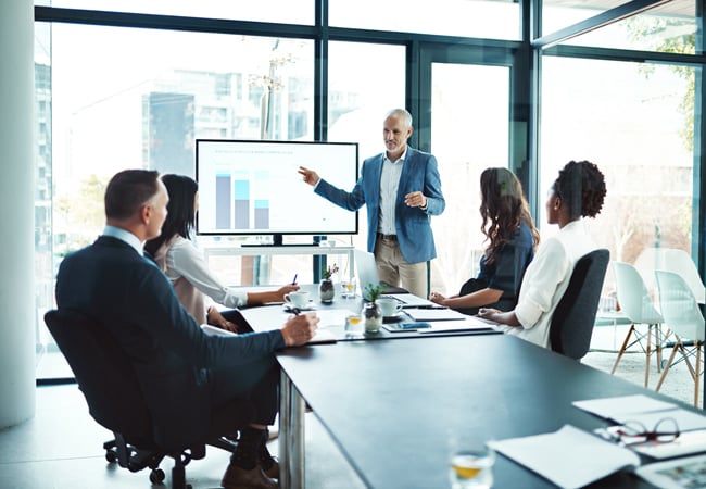 Interim leader giving presentation in meeting