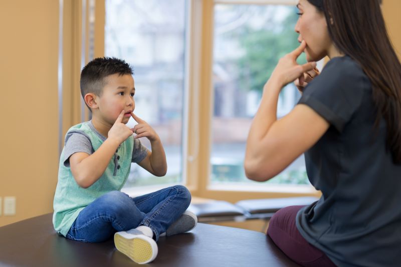 speech language pathologist working with child